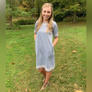 Boutique knit dress with embroidered detail around neck and sleeves